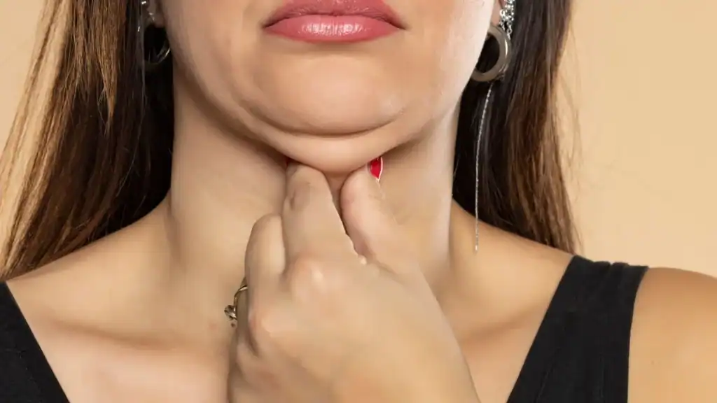 An image of a woman with double chin, sad, worried : Non Surgical Double Chin Removal Treatment in Chatham, UK