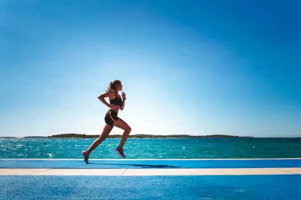 Woman running showing strong leg muscle Chatham